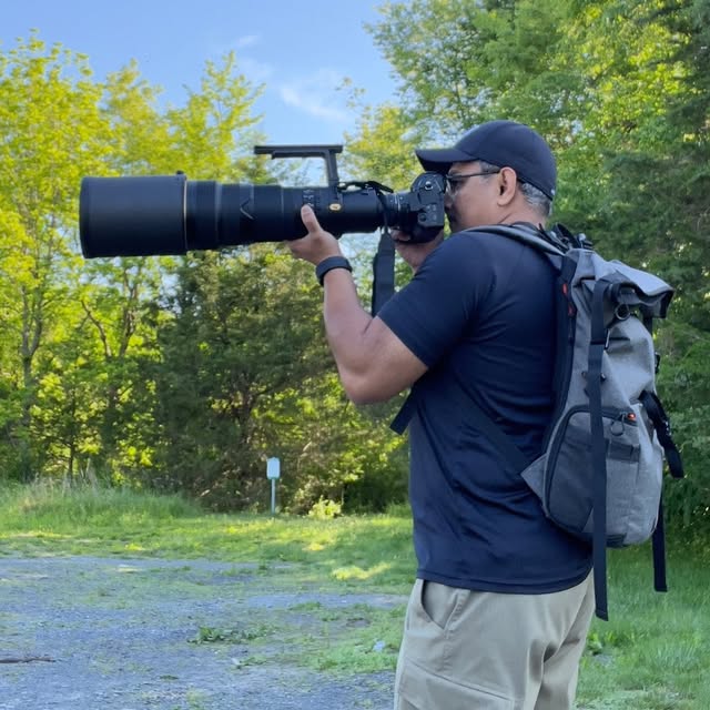 Nirav photographing wildlife in the field